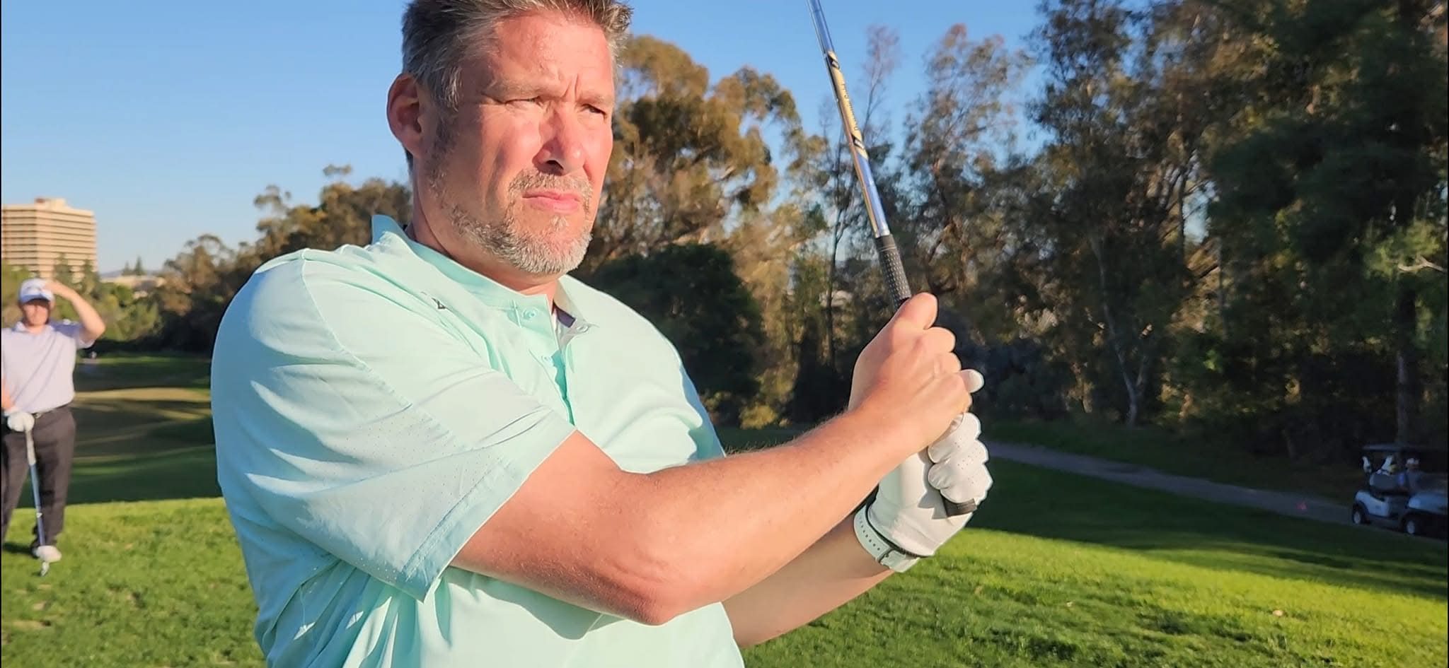 Dana Gorbahn following through on a golf swing